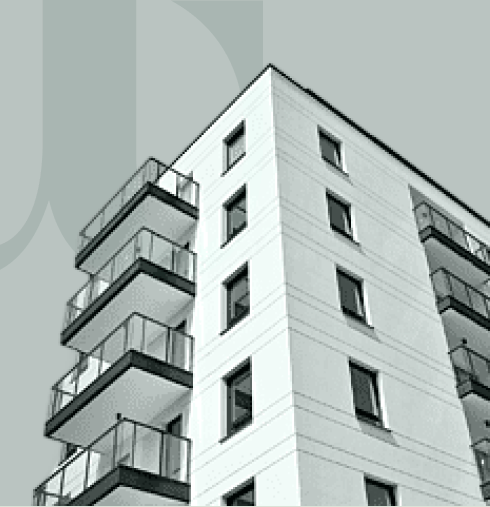 A white multifamily apartment building with balconies, seen from below