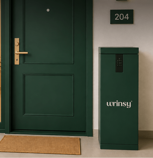 A green wrinsy service box beside a dark green apartment door, unit 204