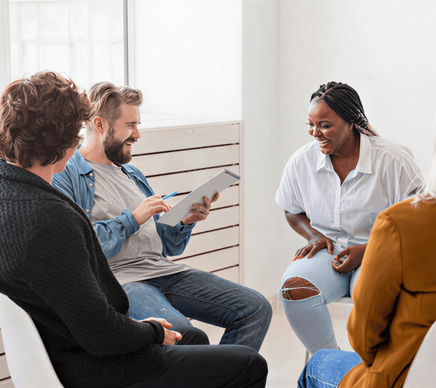 A group of people talking together in a meeting
