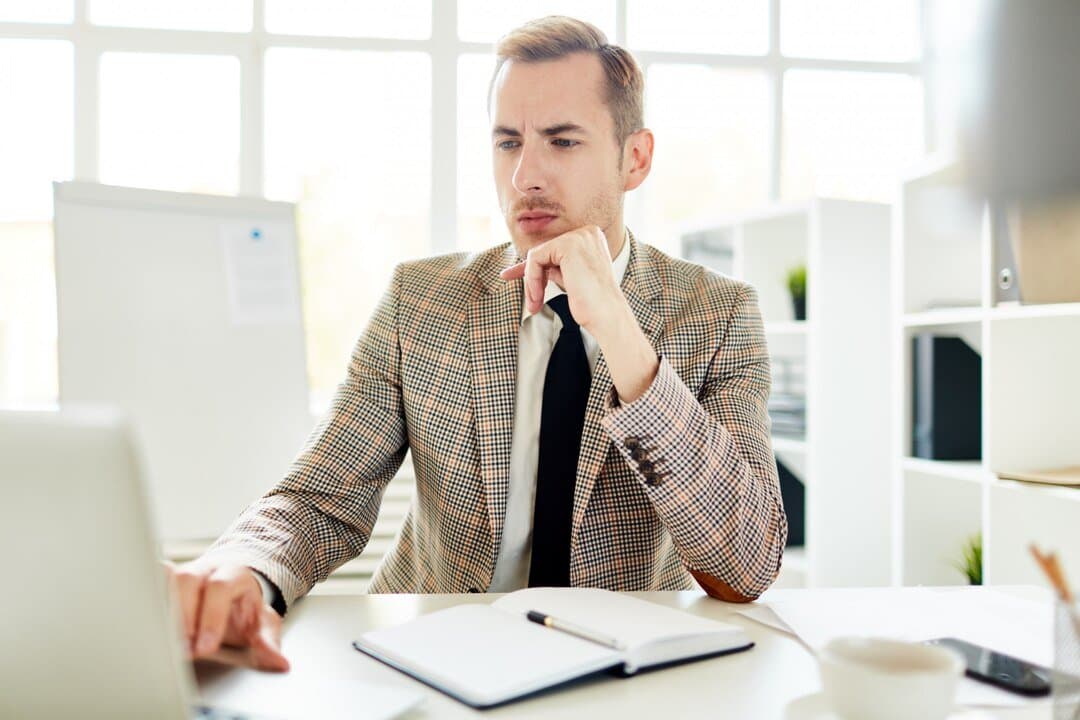 A property owner thinking at his desk