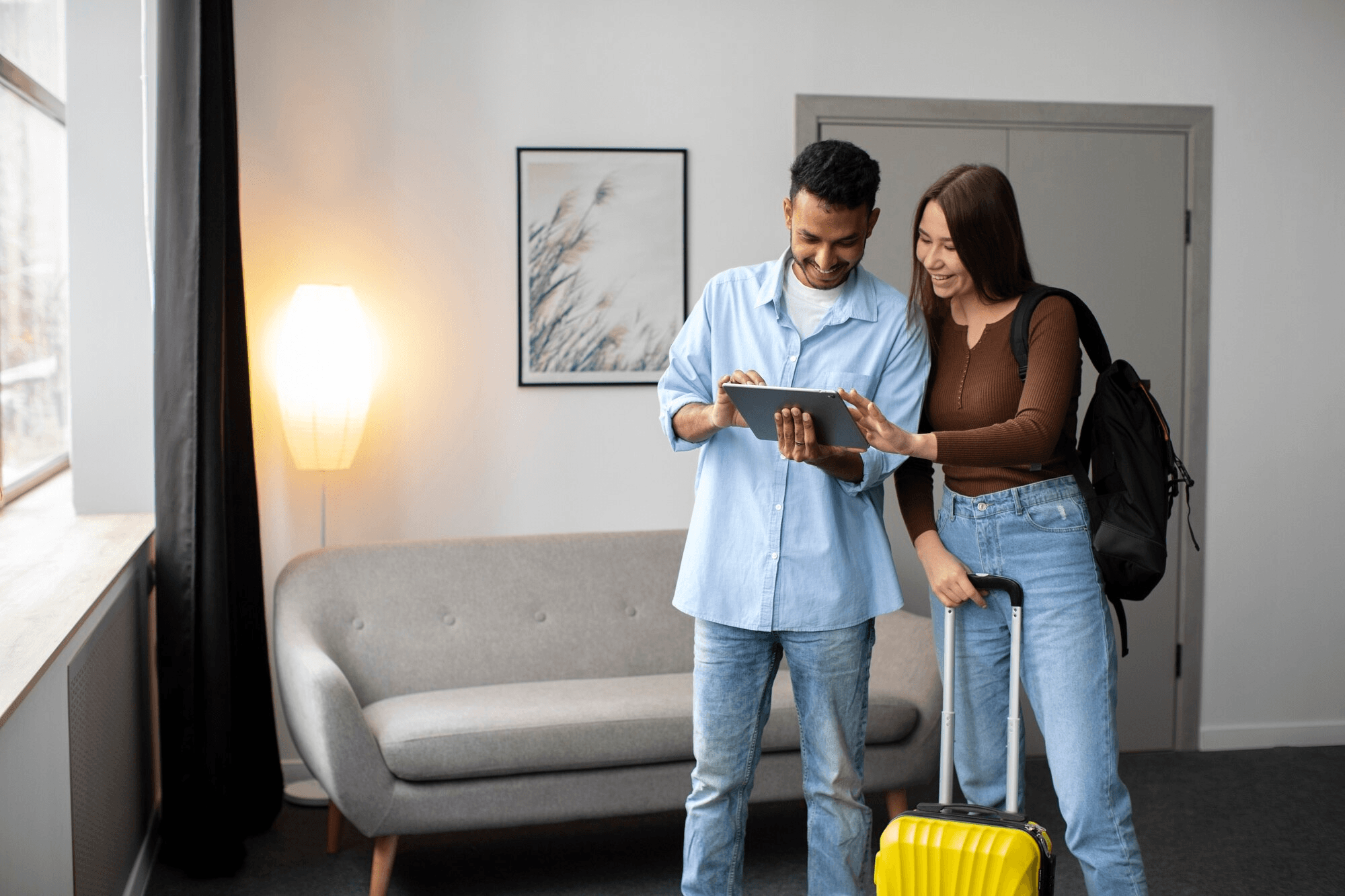 A couple reviewing details together on a tablet