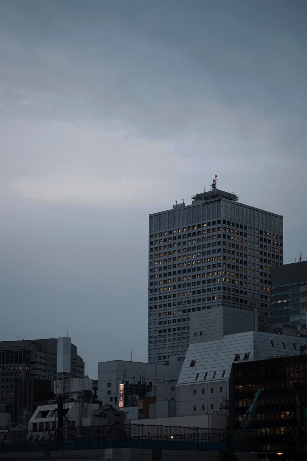 A city skyline of residential high-rises at dusk
