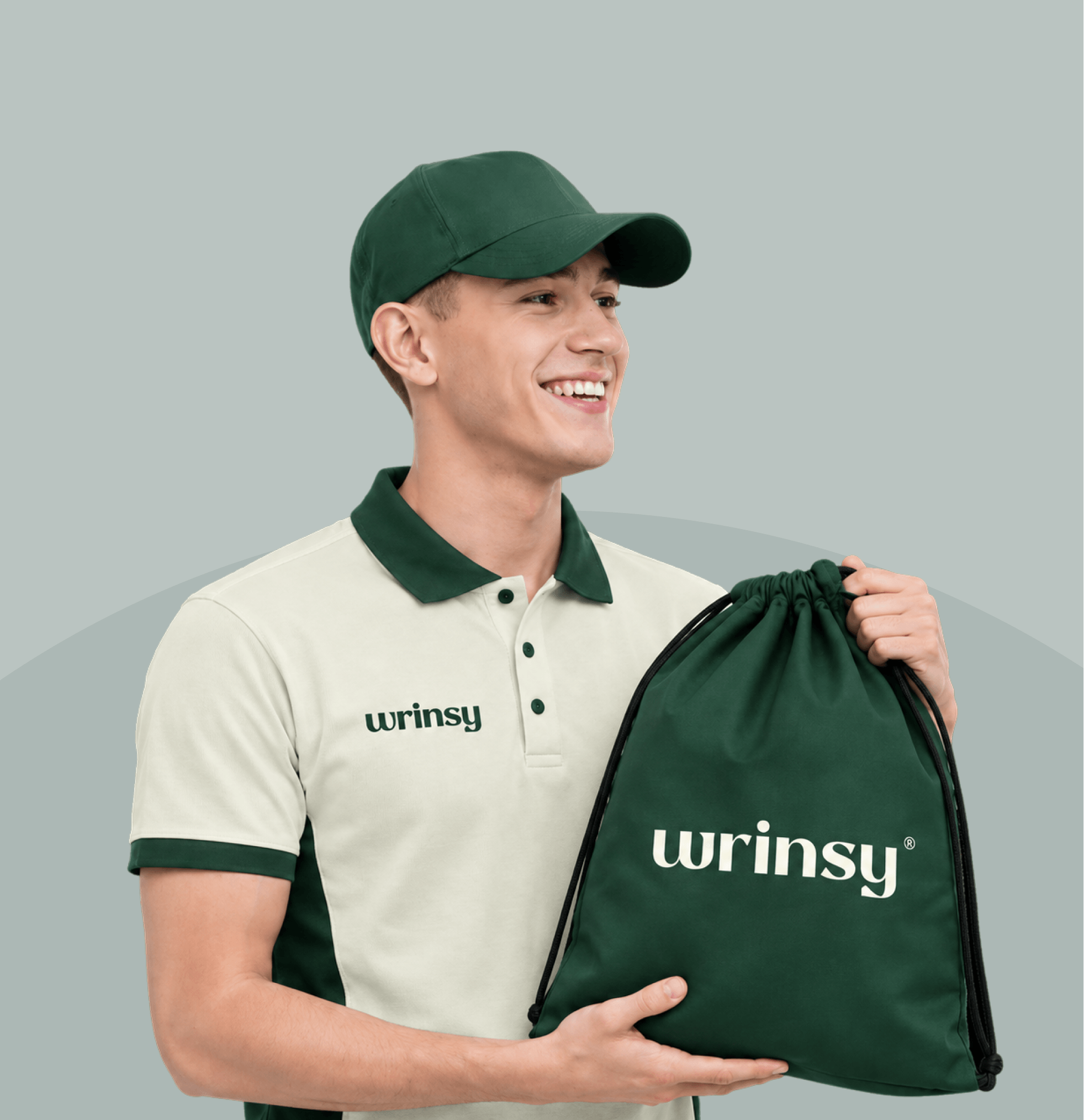A wrinsy courier handing a laundry bag to a resident in a lobby