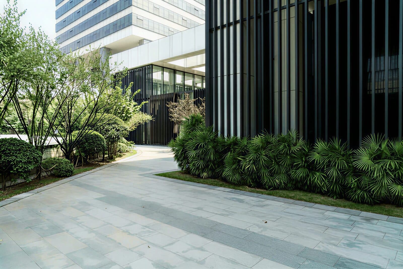 Modern residential building exterior with landscaping
